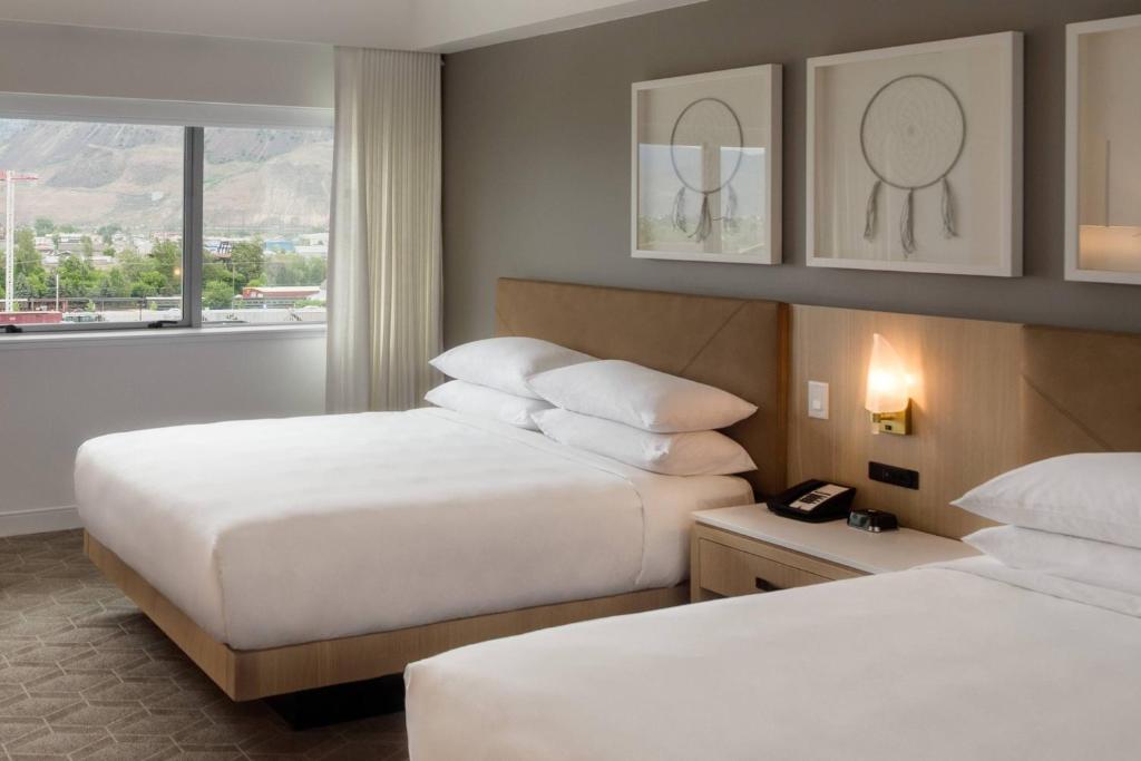 Guest Room with one king bed in a luxury black and gold style